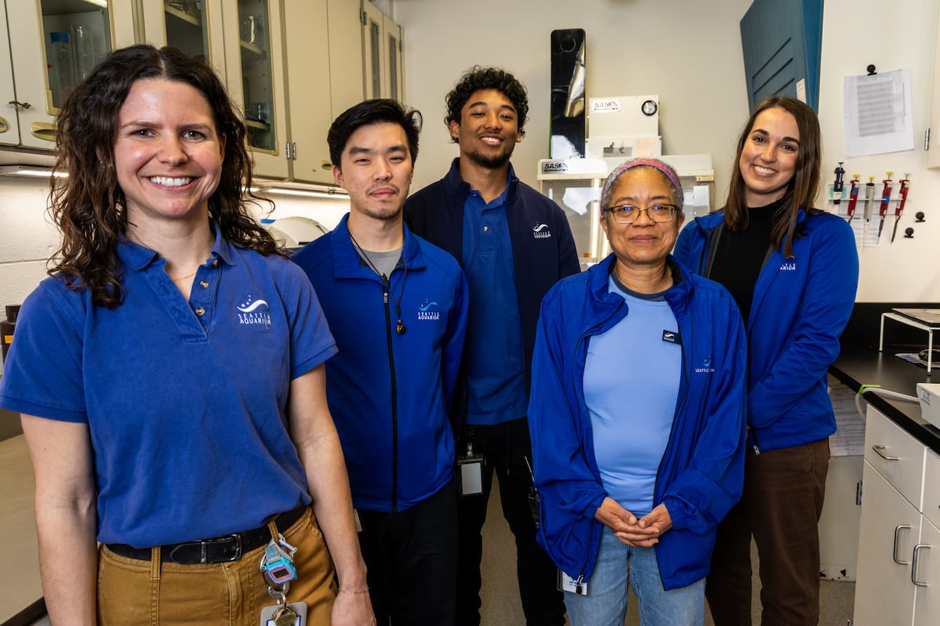 The five members of the Seattle Aquarium's water quality team standing together in their lab.