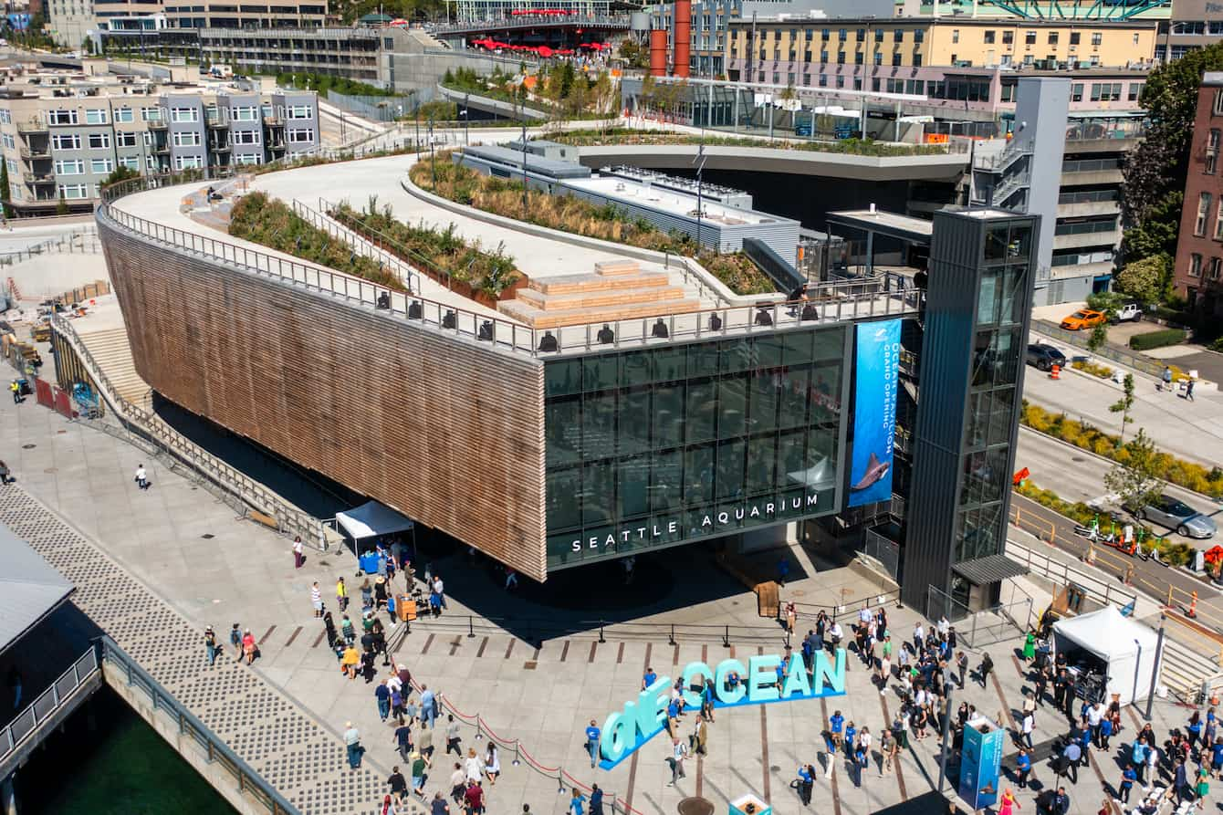 An exterior shot of the Ocean Pavilion with a large crowd in front.