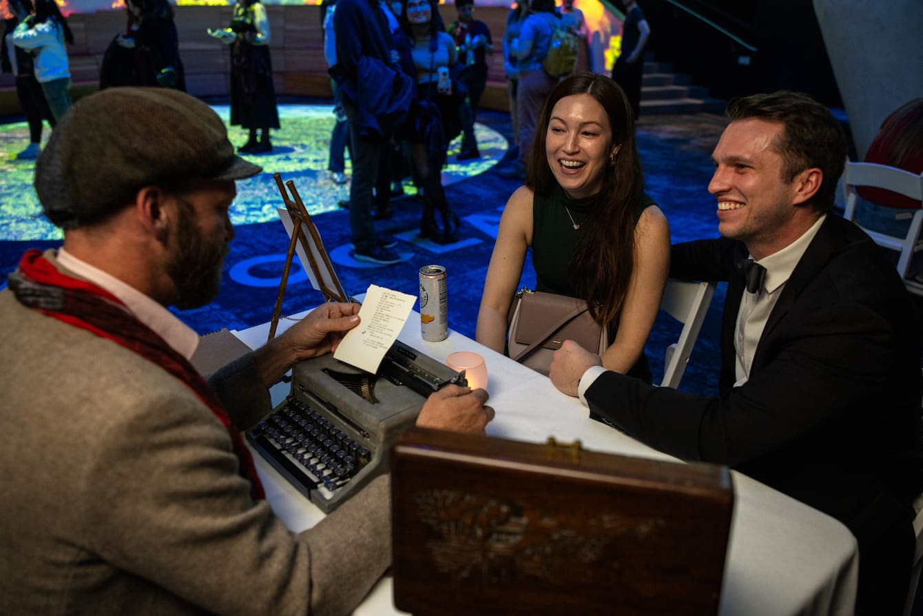 A person reading a typewritten poem to two people.